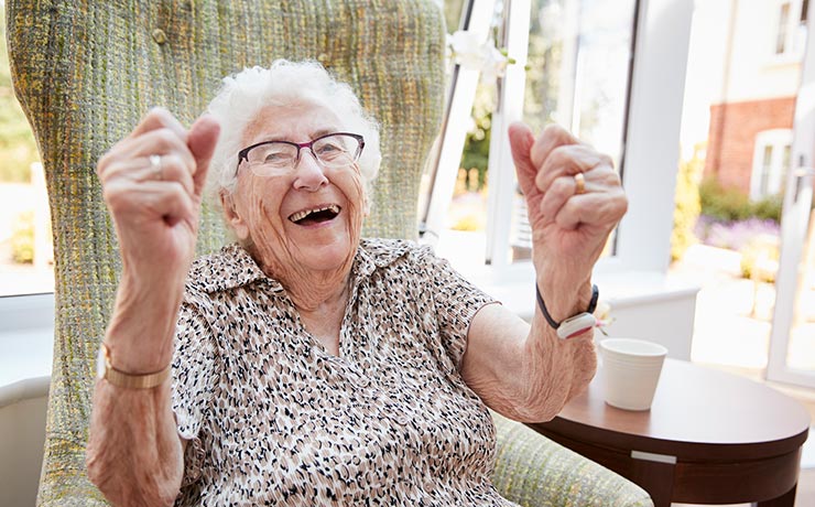 Elderly patient excited in a chair