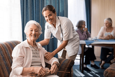 Nurse with patient at an Assisted Living Facility